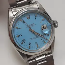 ROLEX DATE 34MM BLUE TURQUOISE DIAL STEEL OYSTER AUTOMATIC WATCH 1500 CIRCA 1974