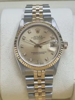 ROLEX DATEJUST 31MM CHAMPAGNE DIAMOND DIAL FLUTED BEZEL