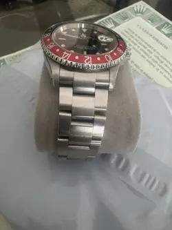 BEZEL/BLACK DIAL W/PAPERS