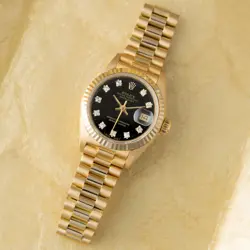 ROLEX LADY-DATEJUST 26 69178, YELLOW GOLD, BLACK DIAMOND DIAL, PRESIDENT BRAC...