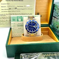 ROLEX SUBMARINER 16613 BLUE DIAL 18K YELLOW GOLD STAINLESS STEEL BOX PAPER