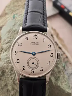 ROLEX MARCONI JUNIOR  A CUERDA DIAL RESTAURADO COLOR  PLATA  CAJA  NICKEL