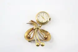 GOLD TONE BROOCH