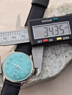 ROLEX MARCONI   A CUERDA DE HOMBRE DIAL RESTAURADO COLOR TURQUESA CAJA NIQUEL