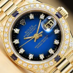 ROLEX LADIES PRESIDENT FACTORY DIAMOND DIAL SAPPHIRE BEZEL 18K YELLOW GOLD WATCH
