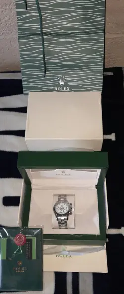 Rolex Daytona 18k White Gold. It's NOT a Fake. I Have All The Paper Work To Prov