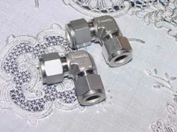 TWO (2) SWAGELOK SS-810-9. TUBE FITTINGS, 90 DEGREE ELBOWS, S/S, 1/2