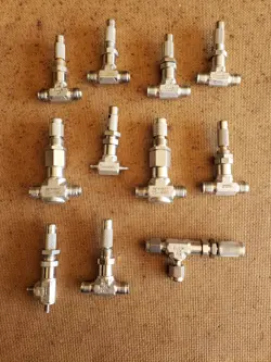 LOT OF NEW AND USED SWAGELOK MICRO METERING VALVES, 11 TOTAL PLUS PARTS