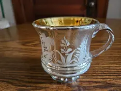 CUP WITH APPLIED