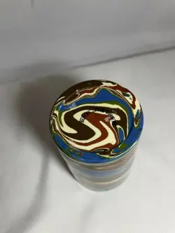 T.