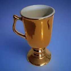 GOLD MUG USED