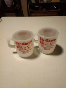 2 VINTAGE ANCHOR HOCKING MADE IN USA. THE GAZETTE COFFEE MUGS