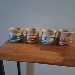 VINTAGE NEMADJI POTTERY SET OF 4 COFFEE MUGS SWIRLED BLUE BROWN ORANGE