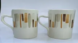 TWO COFFEE CUPS