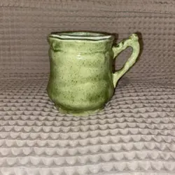VINTAGE HANDMADE GREEN GLAZED TEA STRAINER MUG WITH BROWN SPECKLES