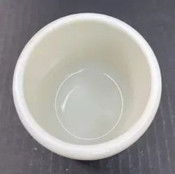 T.