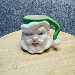 VINTAGE SANTA CLAUS MUG HAND PAINTED CERAMIC WINKING FACE GREEN HAT 4IN SIGNED