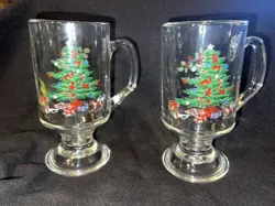 NIKKO HAPPY HOLIDAYS/ CHRISTMAS CLEAR FOOTED GLASS WARE VINTAGE MUGS SET OF 2